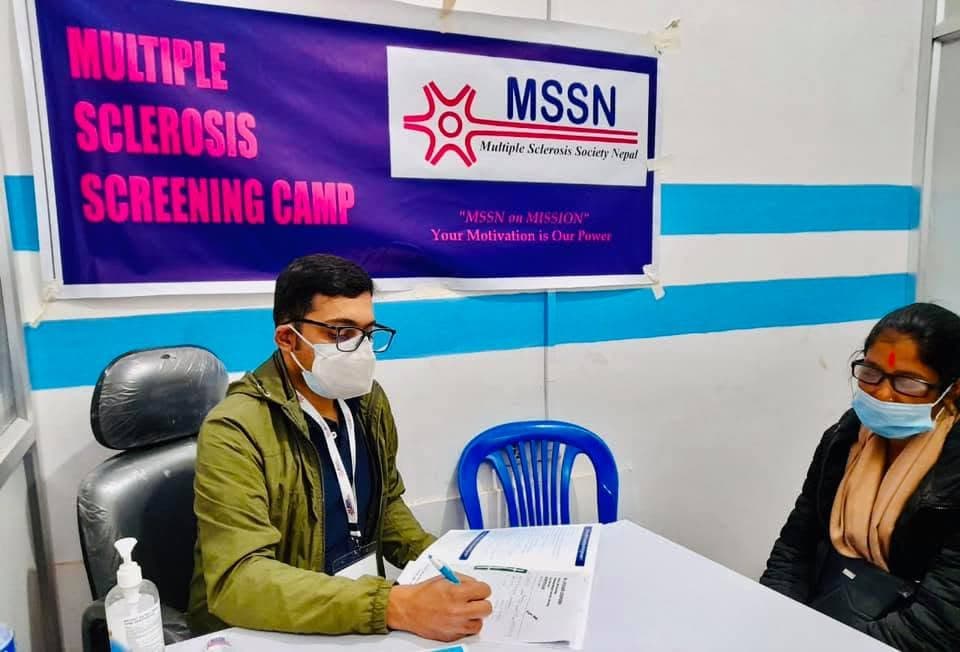 Screening of people by doctor for ms at clinic